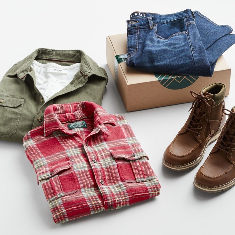 stitchfix for men clothing and boots sitting next to a box.