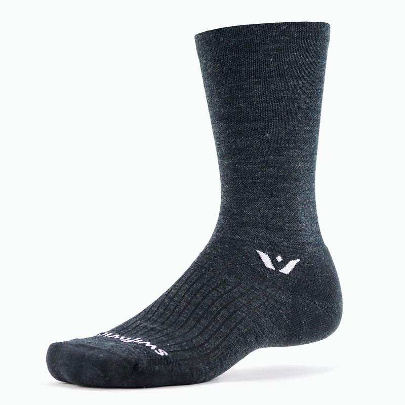 A Swiftwick Pursuit Seven Merino Wool Sock on gray background.