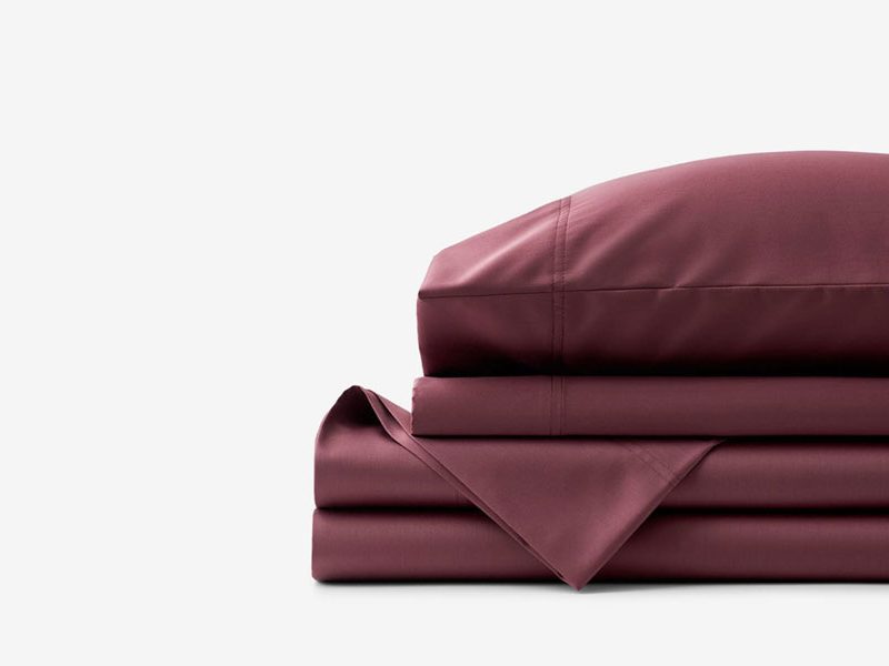 A folded The Company Store Legends Hotel Sateen Sheet Set.