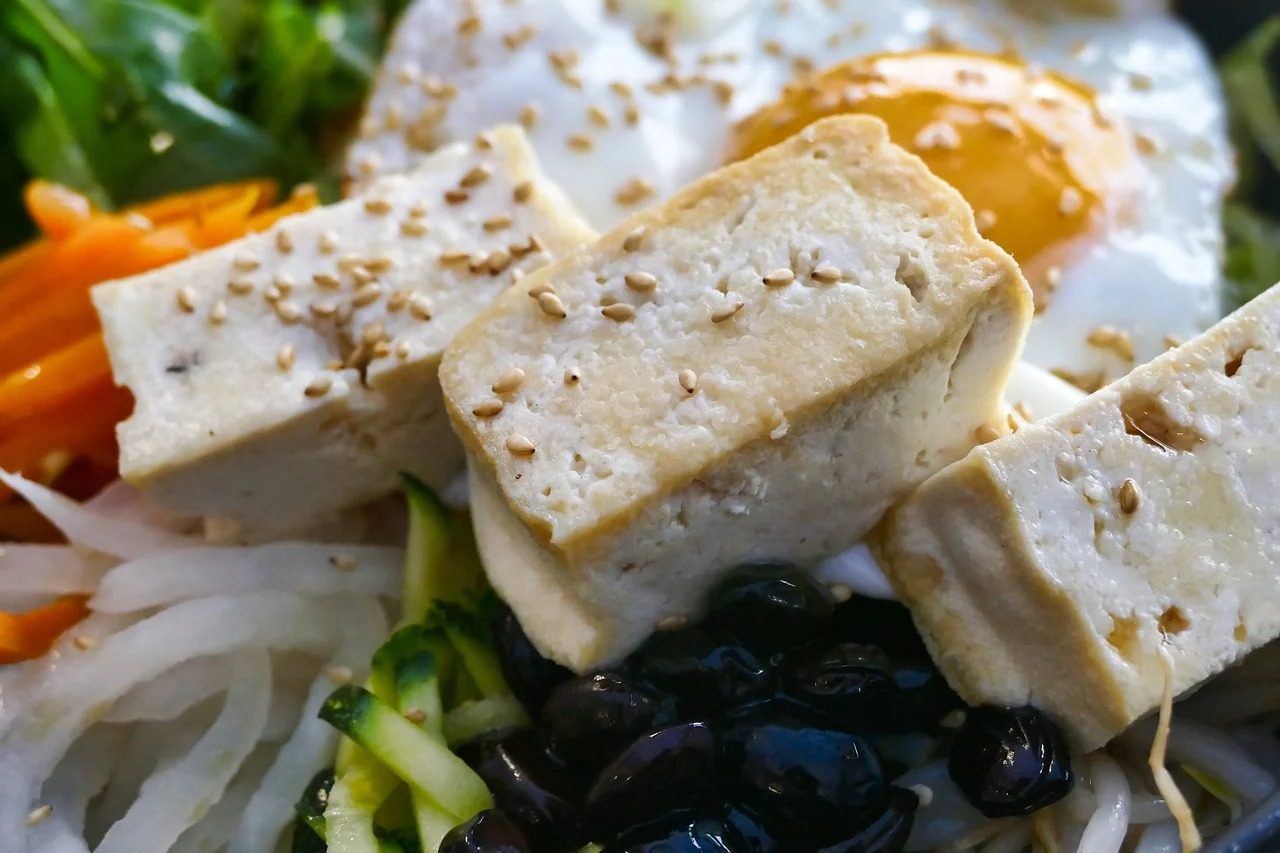 Cubed tofu on top of a salad