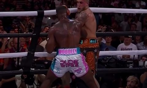 Tyron Woodley lands a big right hand against Jake Paul in their Aug. 29, 2021 bout.