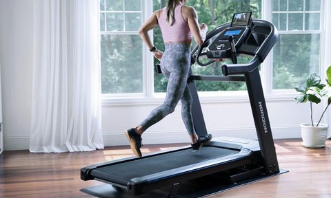 Horizon Fitness treadmill with woman working out.