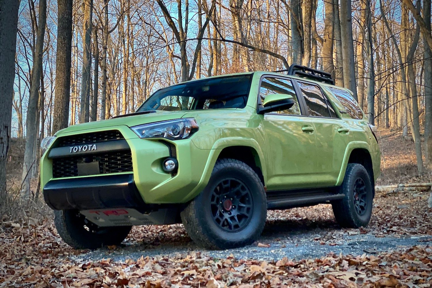 Front end angle of Toyota 4Runner TRD Pro from driver's side with trees in the back.