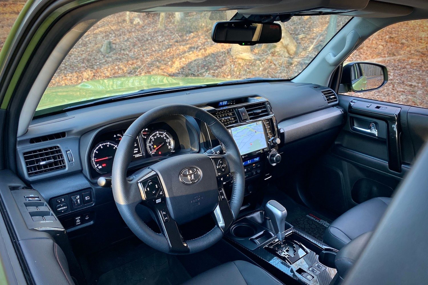 Close up of dashboard in Toyota 4Runner TRD Pro from outside with trees in the back.
