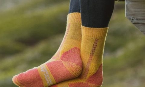 Danish Endurance Merino Wool Hiking socks hanging off a deck