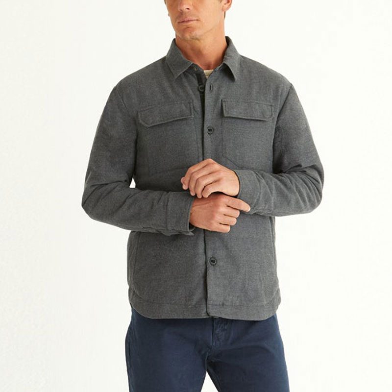 Man wearing Aether's Paulson Insulated Overshirt in Heather Gray on a white background.
