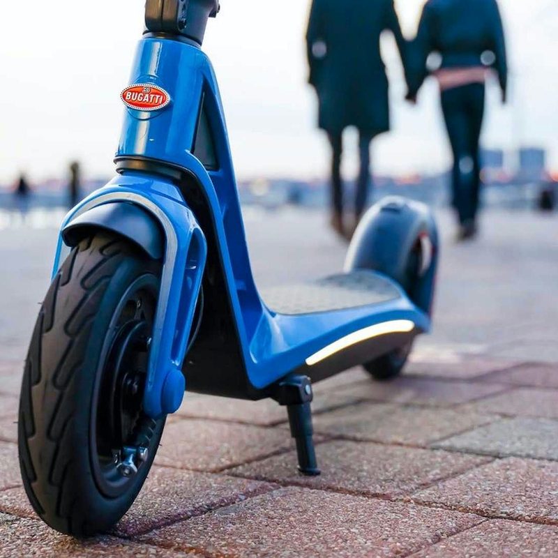 Bugatti all-electridc scooter clsoe up of front end and Bugatti badge.