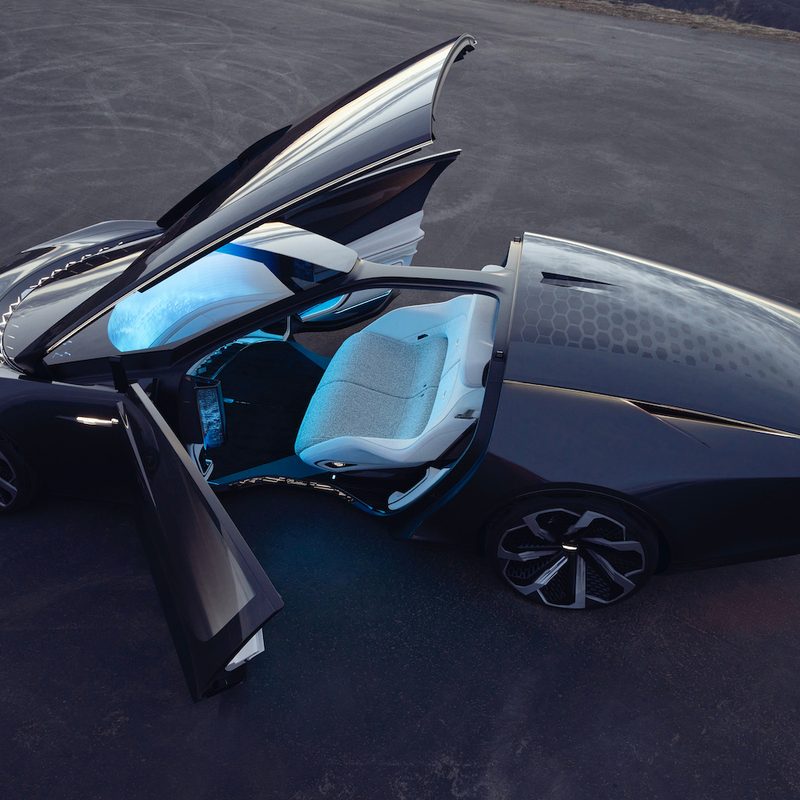 Cadillac InnerSpace Concept from top end with doors open on mountain.