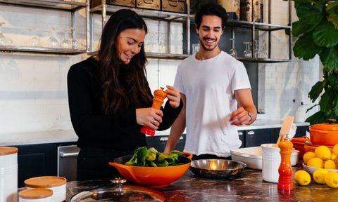Man and woman cooking in kitchen