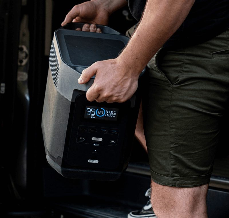 EcoFlow portable power station being unloaded from vehicle.