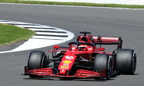 Formula 1 driver exiting turn.