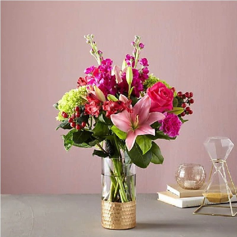 FTD flowers in a modern glass vase.