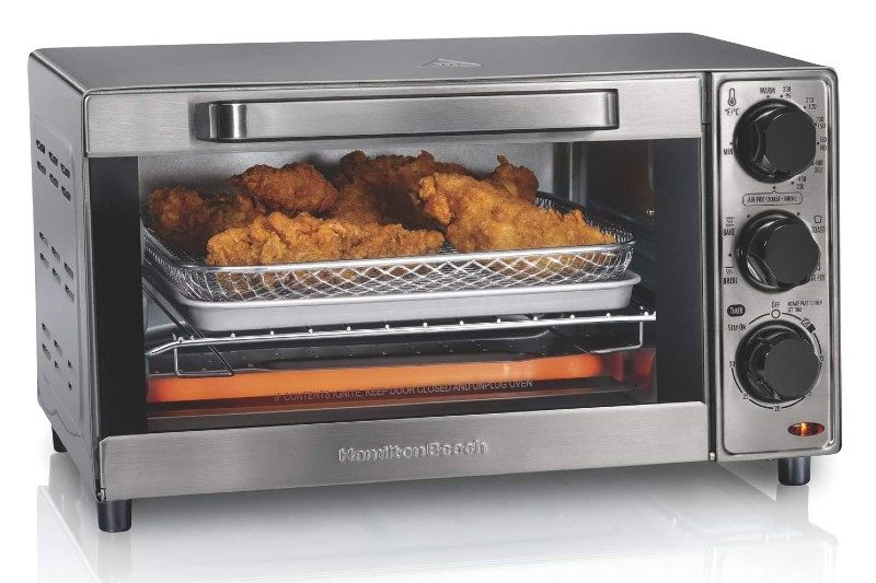Chicken cooking in Hamilton Beach Sure-Crisp Air Fryer Countertop Toaster Oven.
