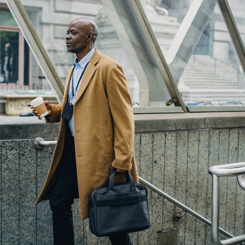 Man in trench coat with briefcase