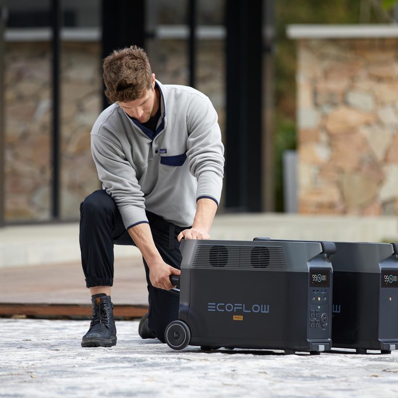 Man moving EcoFlow DELTA Pro ecosystem as needed.