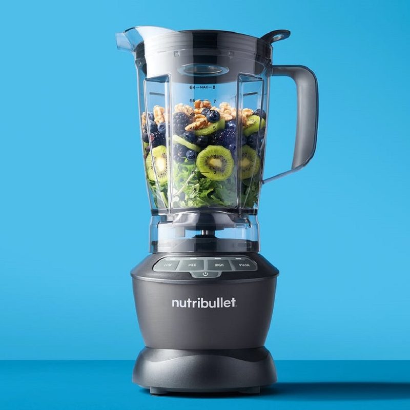 The Nutribullet 1200W Full Size Blender with ingredients inside.