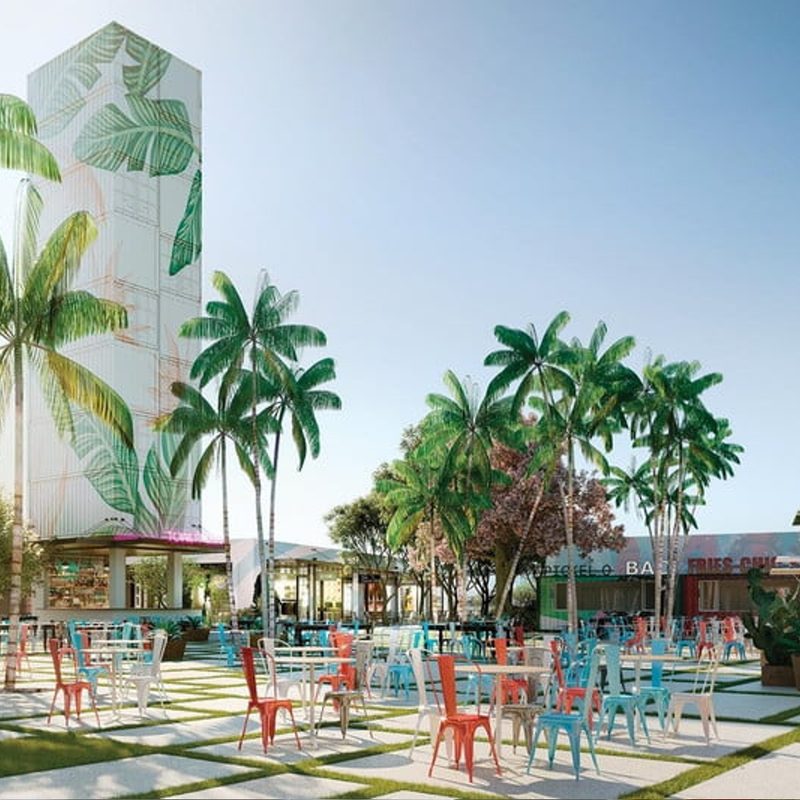 Tables, chairs, and building of Miami Oasis.
