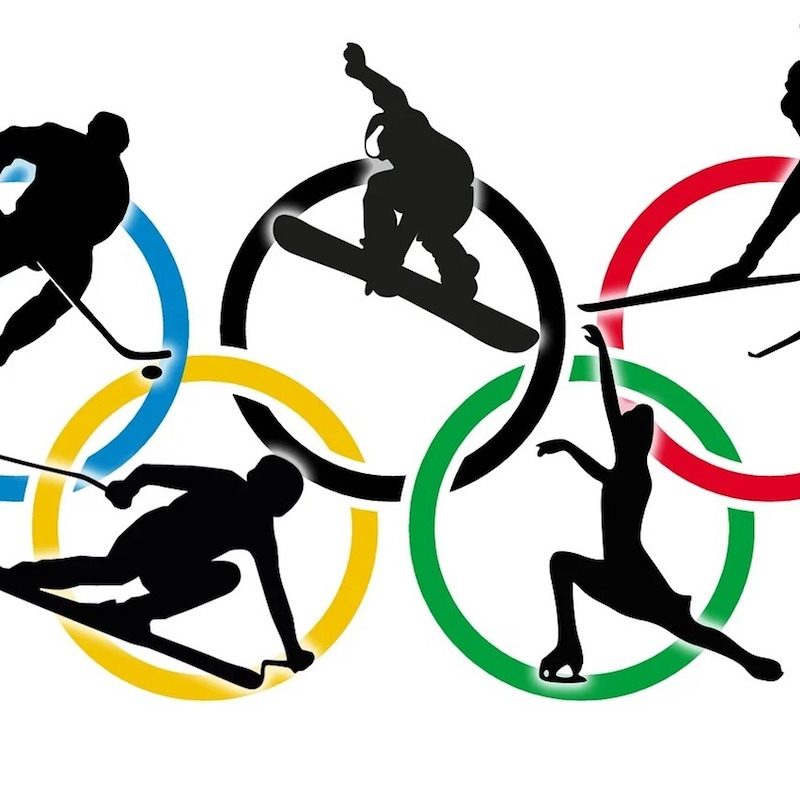 Winter Olympics rings with the images of athletes within.