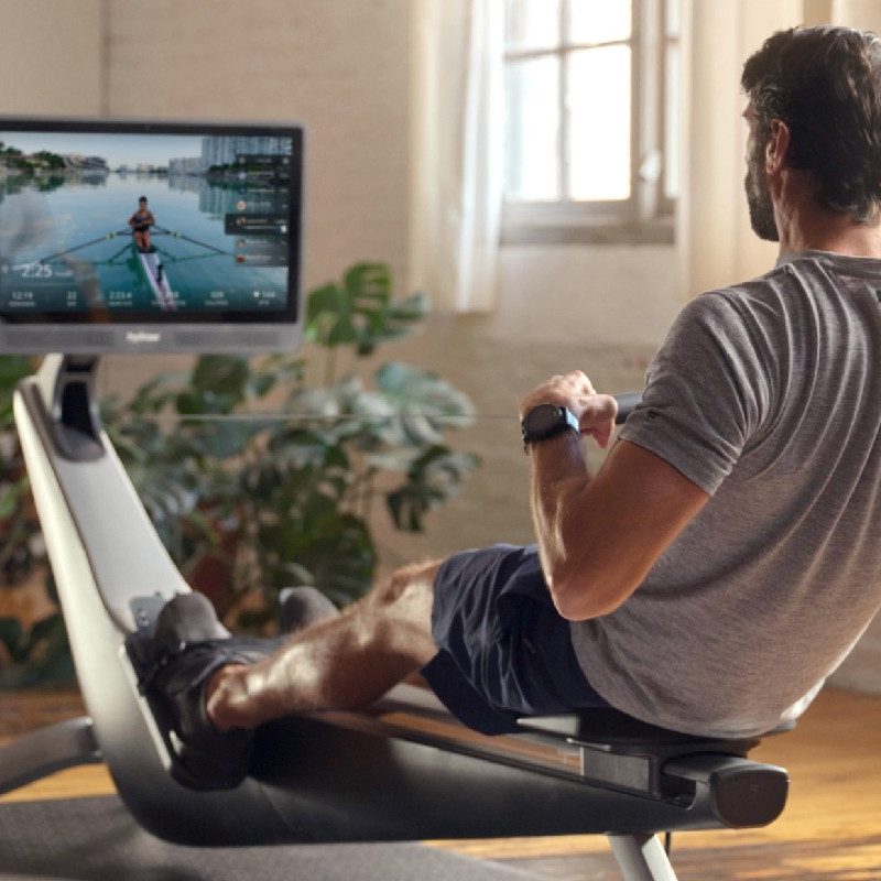 Man rowing on Hydrow rowing machine.