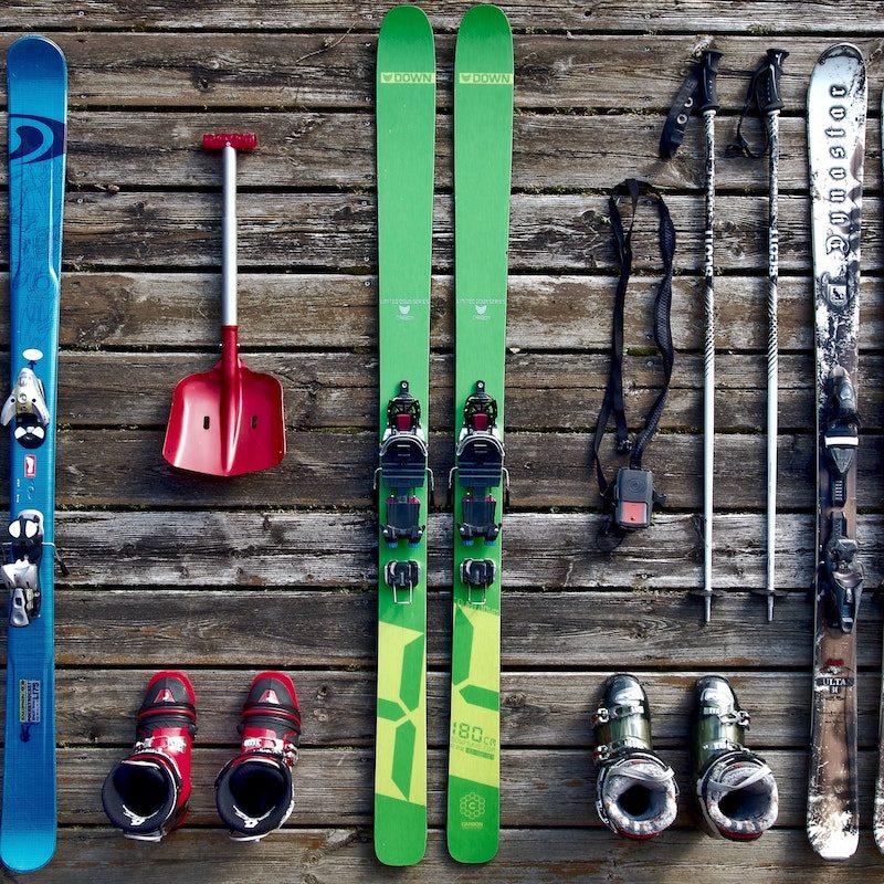 Skis laid out with boots.