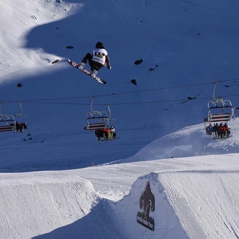 Snowboarder catching some air at the Olympics.