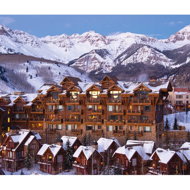 Telluride Ski Resort with snow-capped mountains in the distance