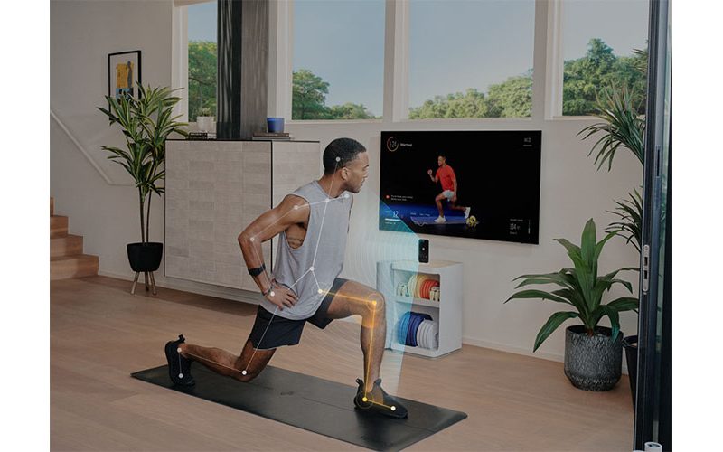 A man using Tempo Move in front of his TV.