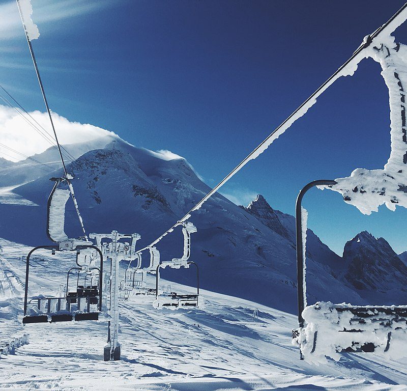 Snow-covered chair lifts over the ski resort at Val d’ Isere and Tignes, France.