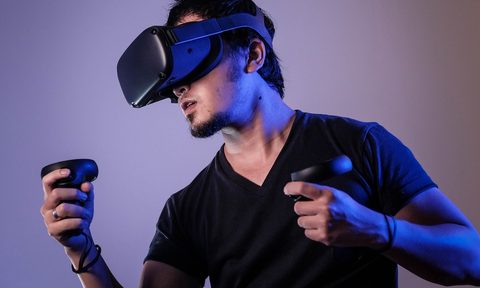 Man playing VR fitness game with Oculus