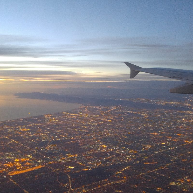 A look outside the airplane during nightfall.