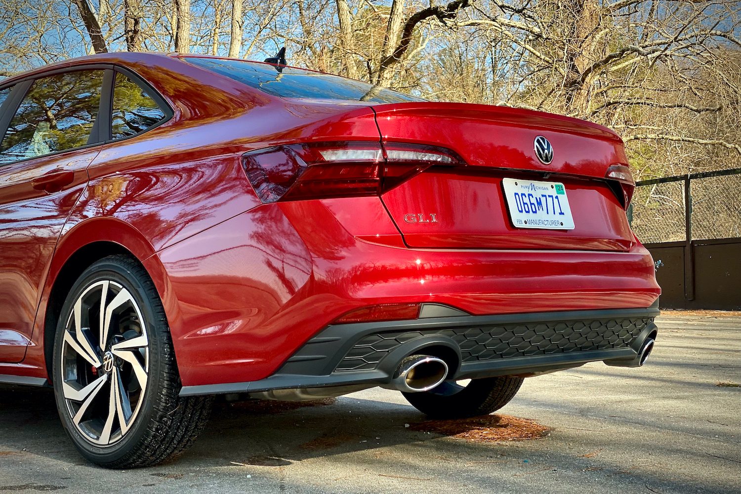 Rear end of 2022 Volkswagen Jetta from the driver's side in a concrete parking lot.