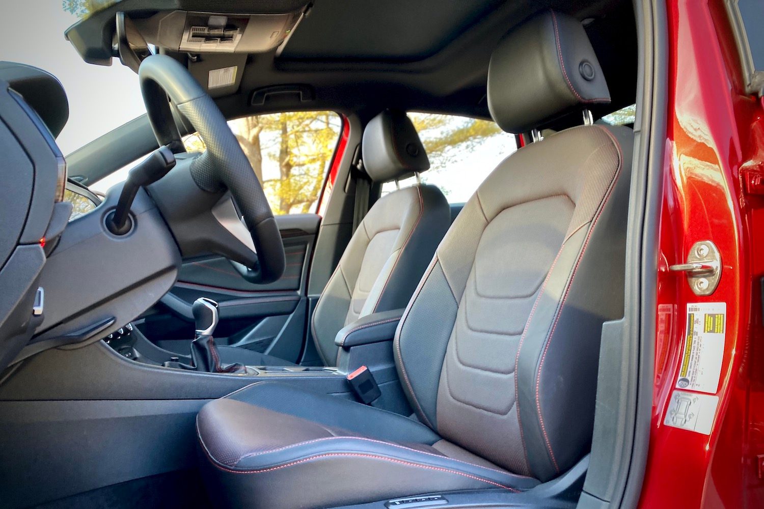 Close up of driver's seat in 2022 Volkswagen Jetta GLI from outside.