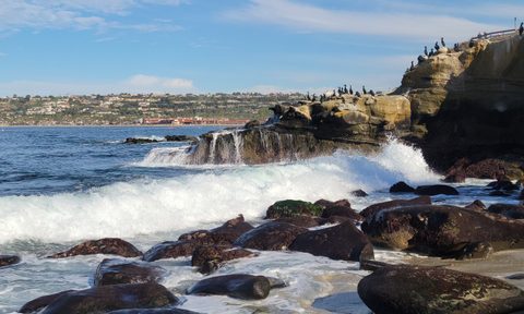 A waterfall forms as the waves hit La Jolla Cove in San Diego, California.