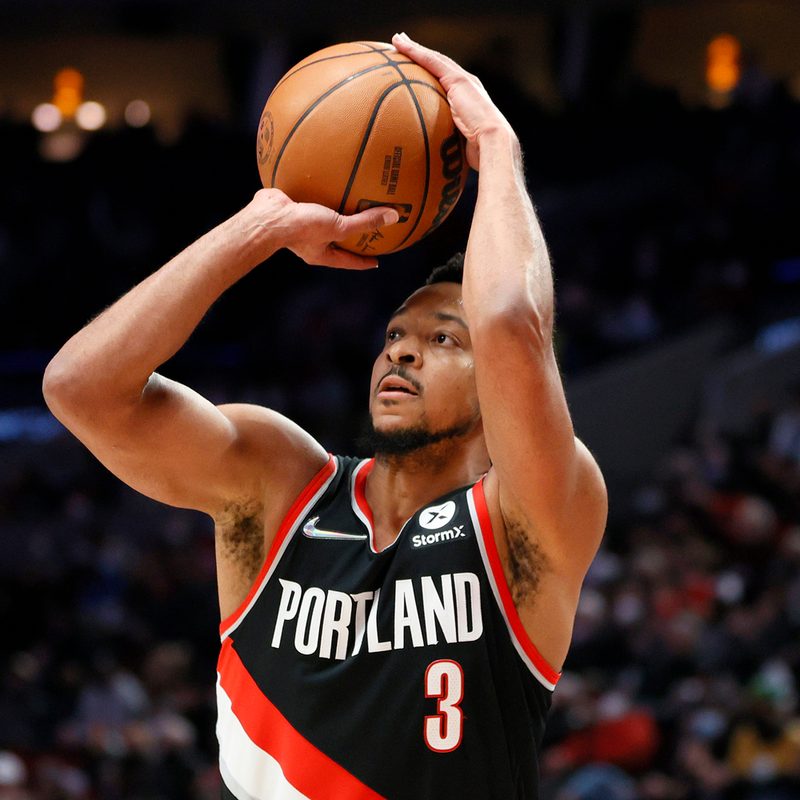 CJ McCollum about to shoot a ball during a match.