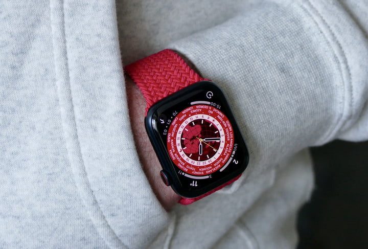 Blue Apple watch over a white background.
