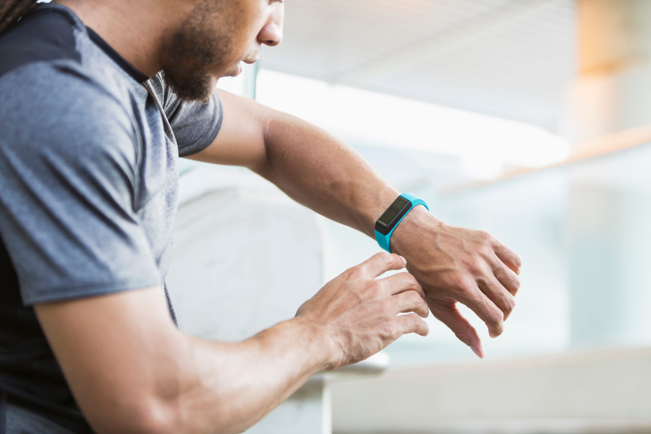 Youngman checking his fitness tracker.