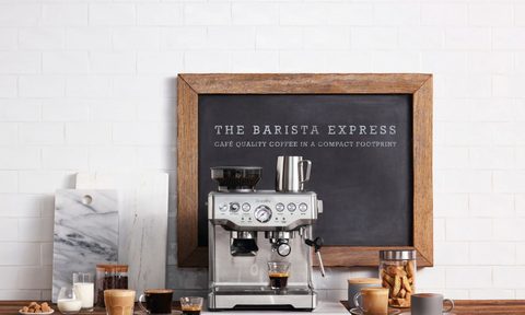 Breville's The Barista Express with beverages on a table.