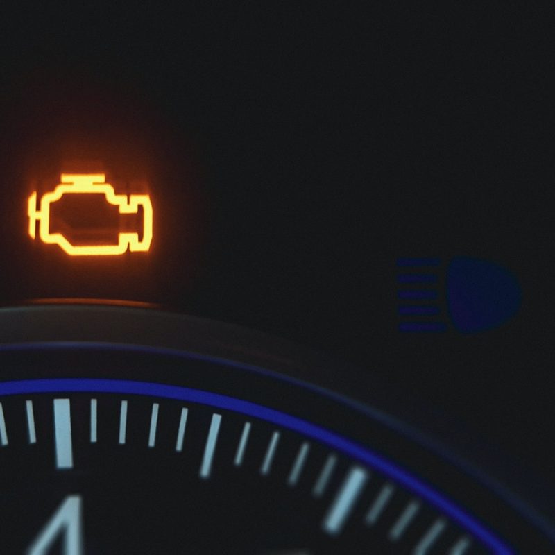 Check engine light on a car dashboard.