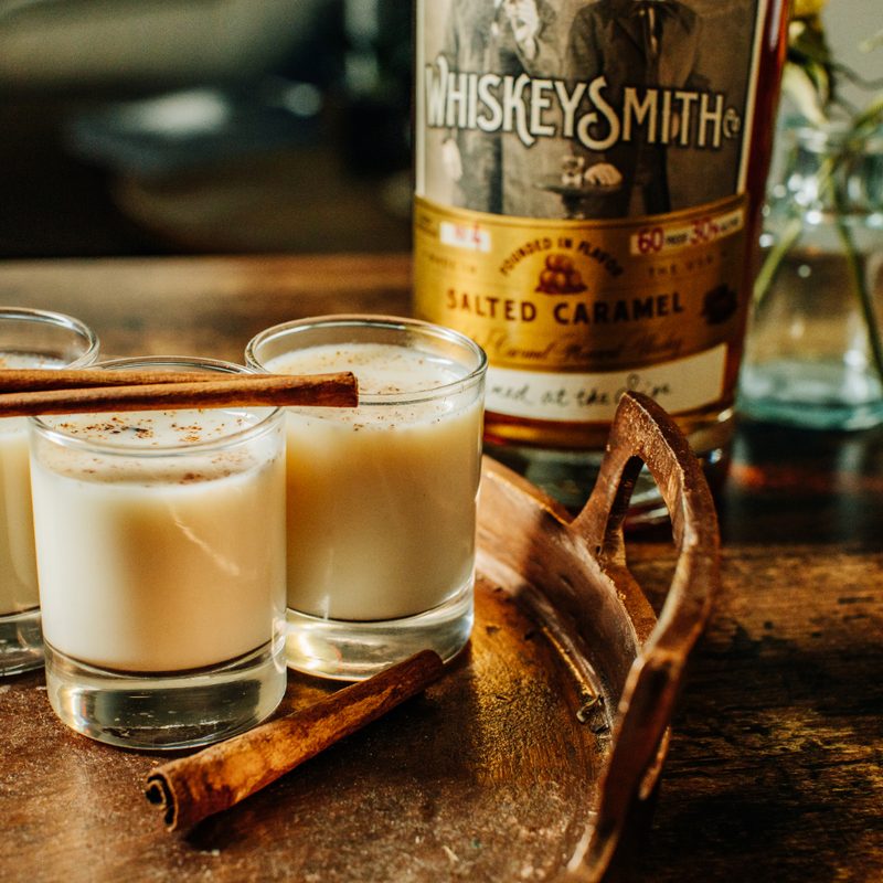 Cinnamon Toast Shooter cocktail on a wooden counter.