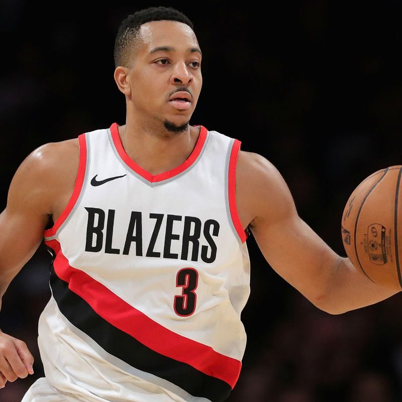 CJ McCollum about to dribble a basketball.