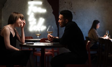 A couple on a romantic dinner date together.