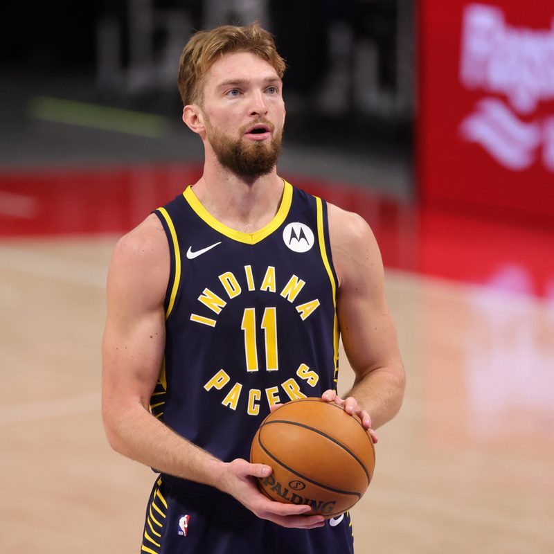 Domantas Sabonis preparing to execute a free throw during a match.