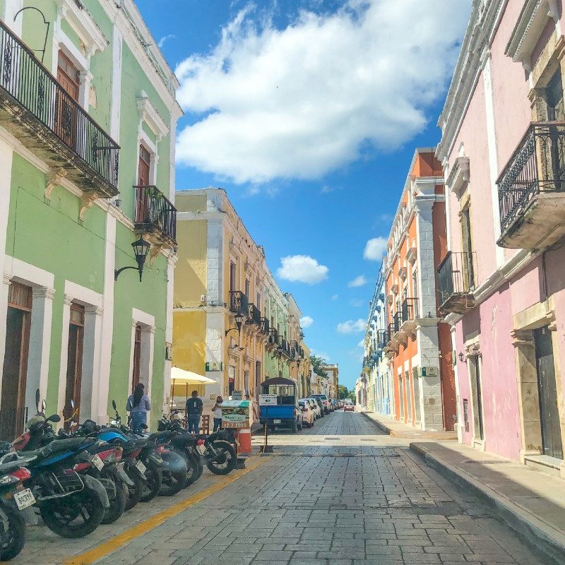 A street in downtown Campeche with motorcycles.