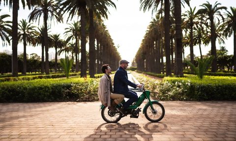 Eric Cantona (front) and photographer and Looking FC partner Karim Chater (back) on a motorbike in Casablanca.