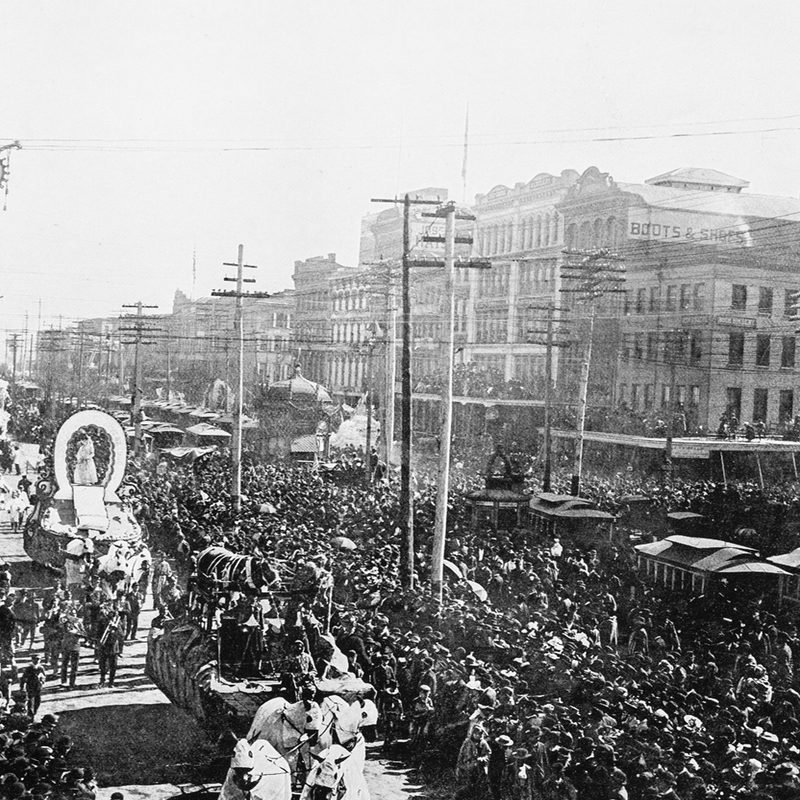 A Mardi Gras parade at New Orleans in grayscale.
