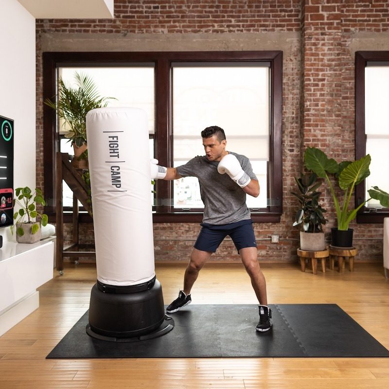 Man hitting FightCamp bag.