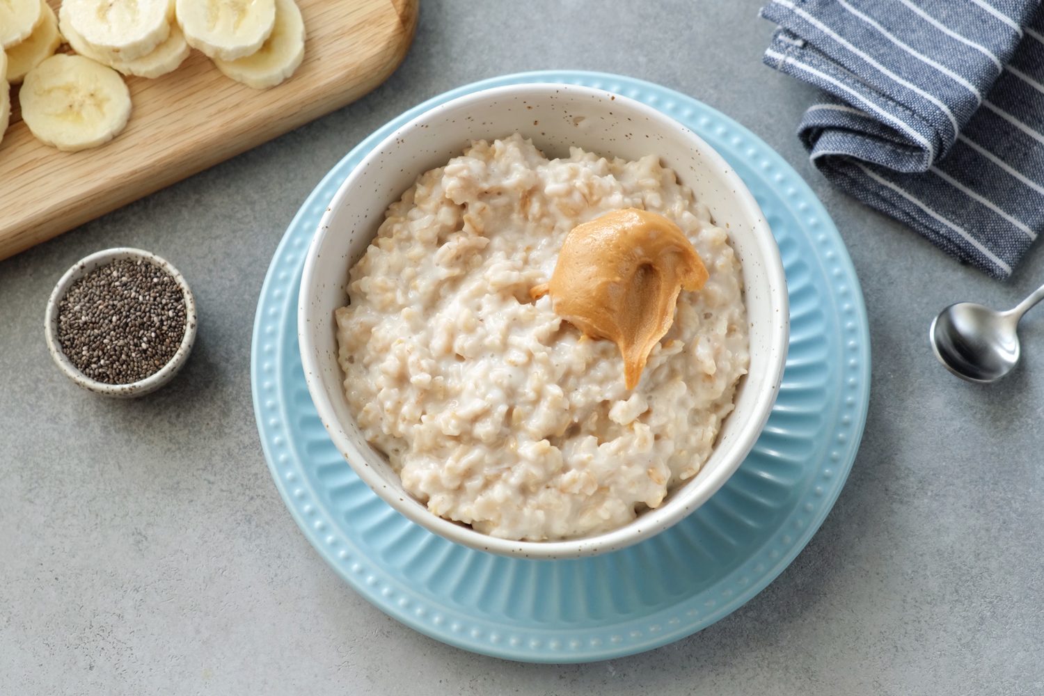 A bowl of oatmeal with peanut butter.
