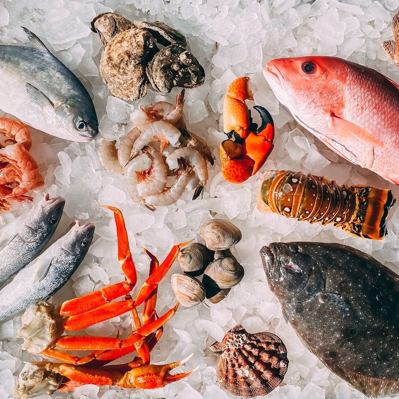 Tray of fish and seafood on ice.