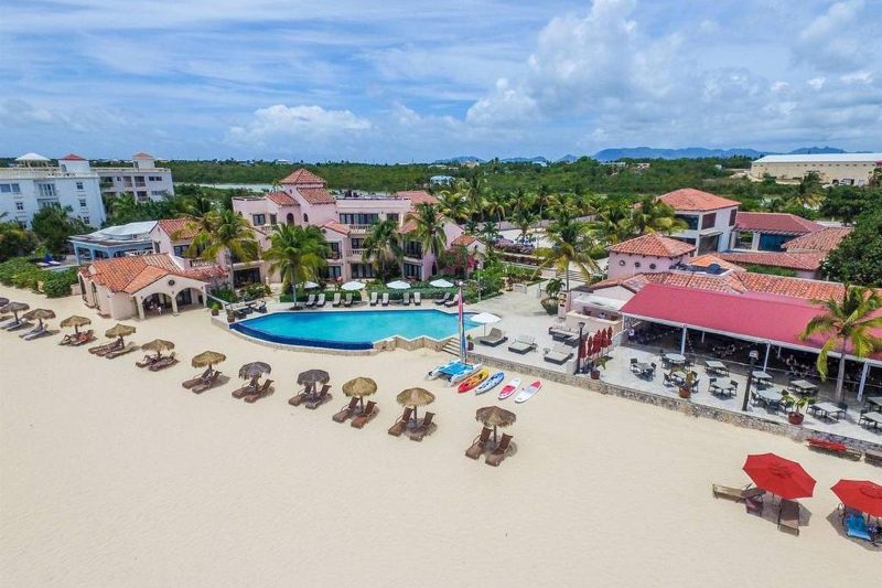 Aerial view of the Frangipani Resort beach and pool area.
