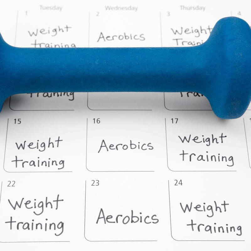 A dumbbell on an exercise plan.